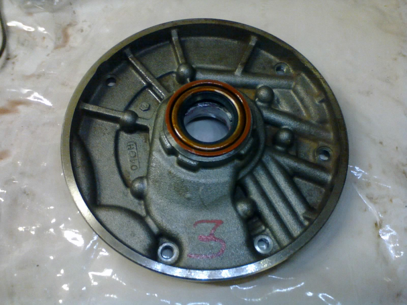 A new seal gets pressed into the pump body. This seal rides against the torque converter snout.